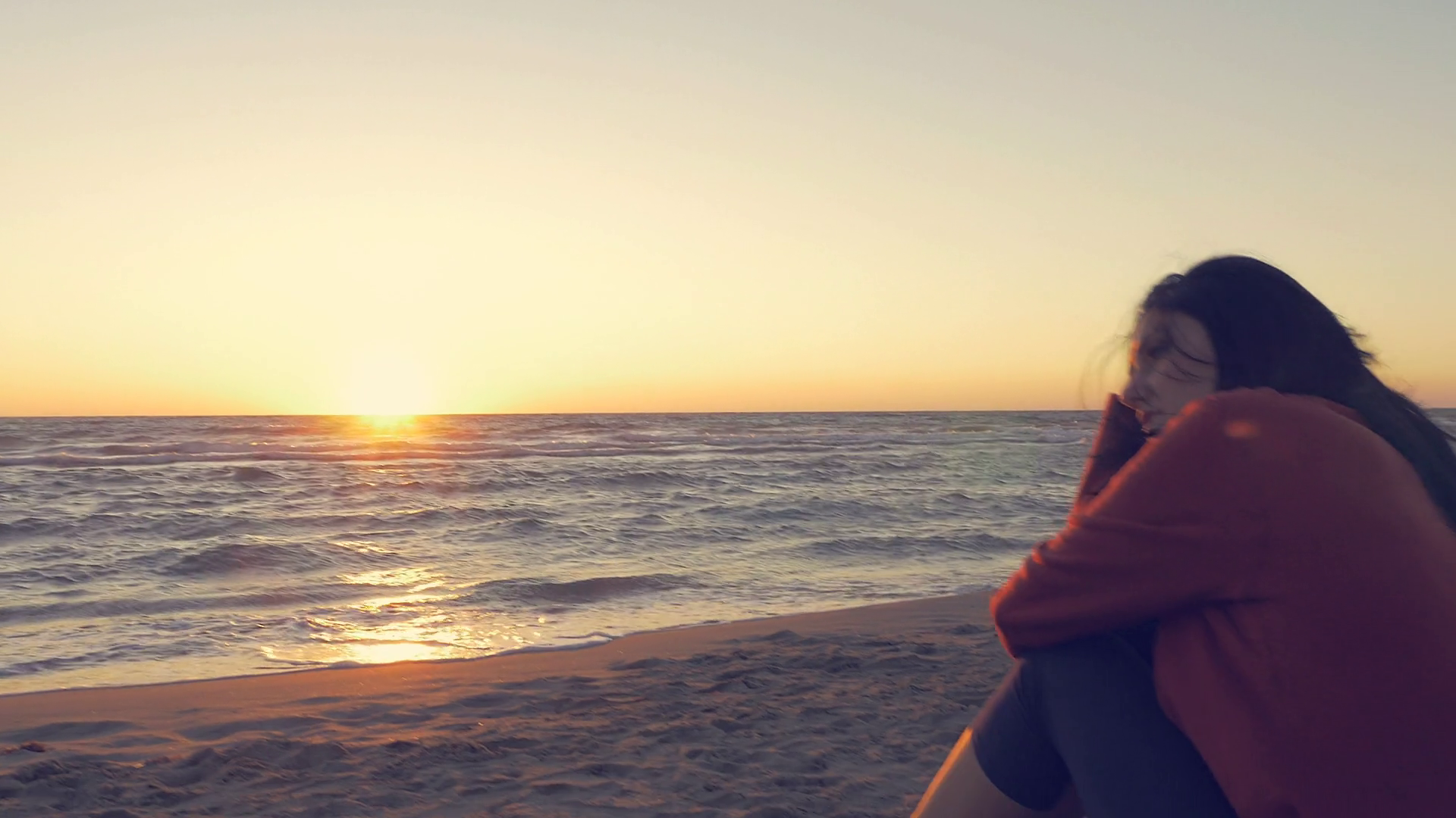 videoblocks-sad-woman-in-front-of-the-ocean-at-sunset-thinking-about-love-ronin-shot_hozj_jwnl_thumbnail-full04.png